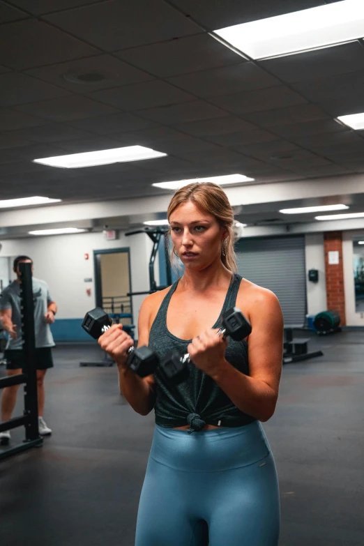 a woman holding a barbell in a gym, by Austin English, carrying two barbells, sydney sweeney, profile image