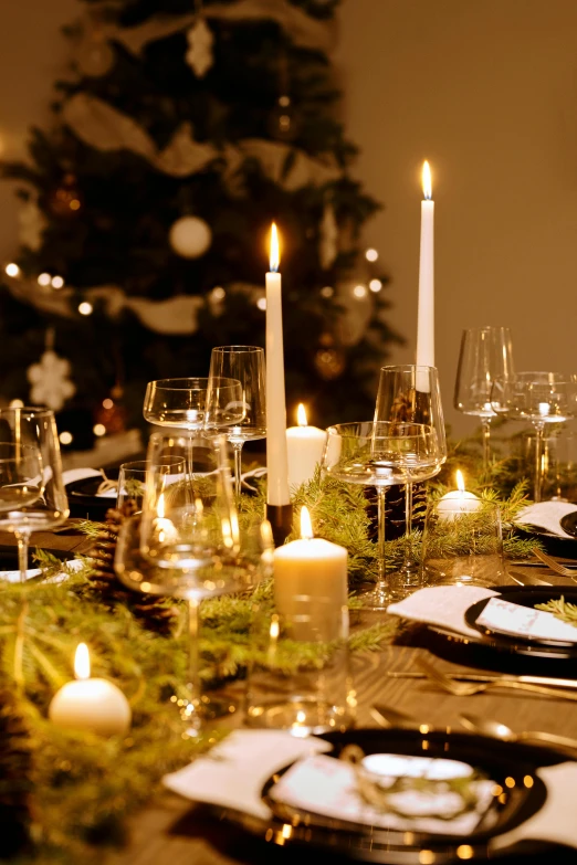 a dining table with a christmas tree in the background, inspired by Constantin Hansen, baroque, natural candle lighting, nigth, lots de details, medium close up