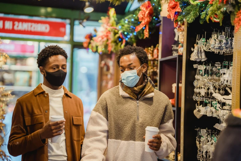 two people wearing face masks in a store, trending on pexels, renaissance, festive, black man, people walking down a street, two cups of coffee