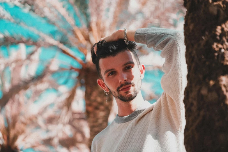 a man standing in front of a tree, an album cover, pexels contest winner, realism, lean man with light tan skin, in pastel colors, he got a big french musctache, avatar image