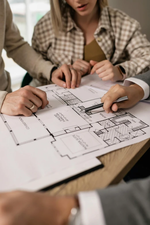 a group of people sitting around a table with blueprints, a detailed drawing, pexels contest winner, architectural plan, promo image, thumbnail, an elegant