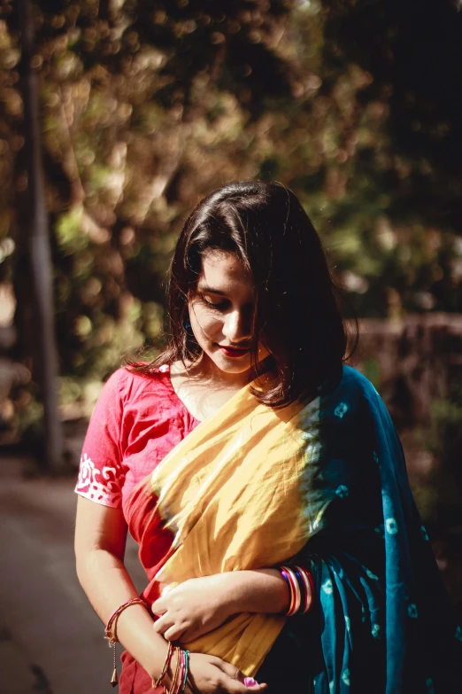 a woman in a red and yellow sari, pexels contest winner, wearing casual clothing, profile image, prompt young woman, cotton
