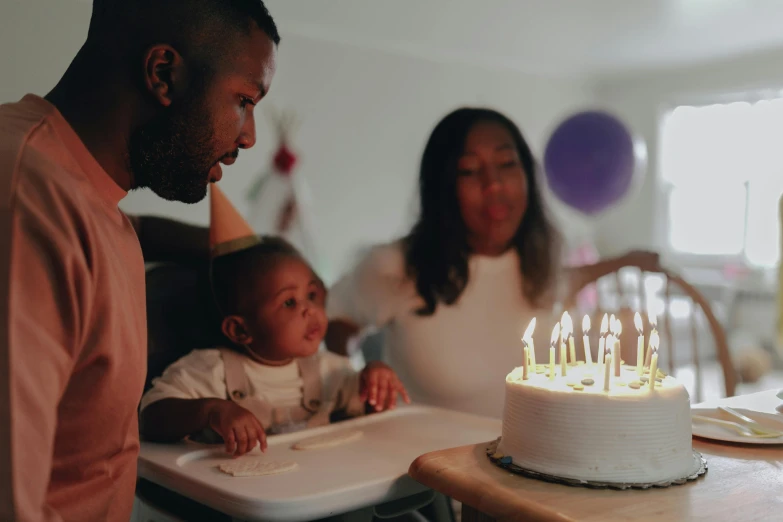 a man blowing out candles on a birthday cake, pexels, husband wife and son, avatar image, diverse ages, cinematic image