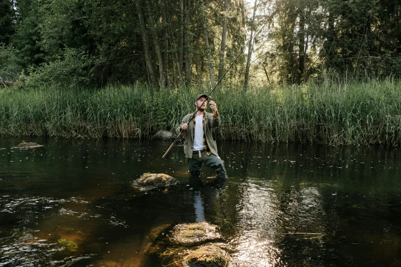 a man and a woman standing in a river, an album cover, unsplash, holding shotgun down, standing in the forrest, lachlan bailey, in an action pose