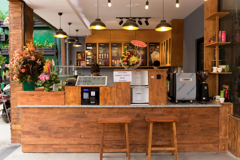 a wooden counter with two stools in front of it, bao phan, modern lush condo as shopfront, profile image