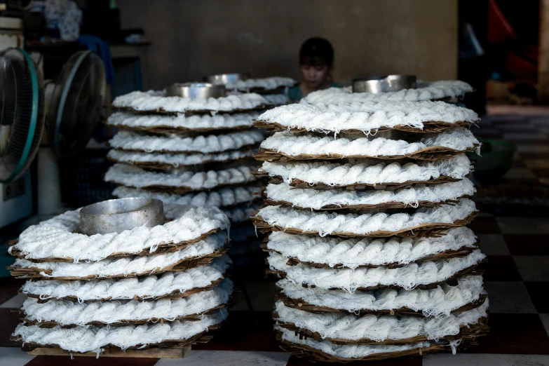 a pile of food sitting on top of a checkered floor, in a factory, bao phan, lots of white cotton, thumbnail