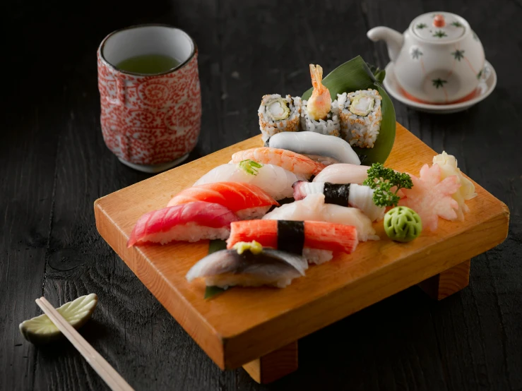 a wooden cutting board topped with sushi and chopsticks, inspired by Nishida Shun'ei, trending on unsplash, ukiyo-e, fishes, taken in the early 2020s, medium angle, kami