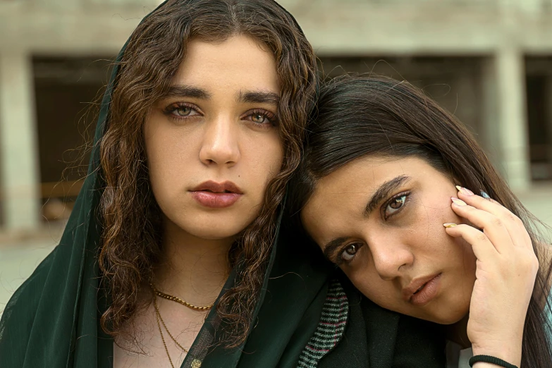 a couple of women standing next to each other, by irakli nadar, trending on pexels, qajar art, thick bushy straight eyebrows, teenager girl, film promotional still, middle eastern