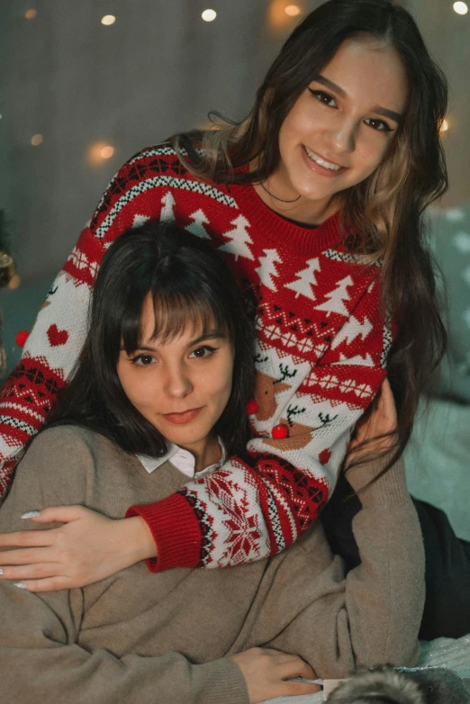 a couple of women sitting on top of a bed, trending on pexels, wearing festive clothing, wearing sweater, avatar image, russian girlfriend