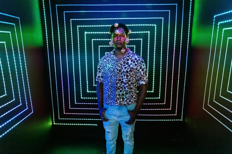 a man standing in front of a wall of neon lights, an album cover, pexels, afrofuturism, intricate led jewellery, dj at a party, full body photo, xxxtentacion