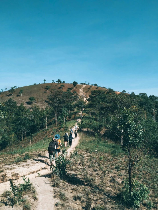 a group of people walking up a hill, myanmar, background image, instagram picture, thumbnail