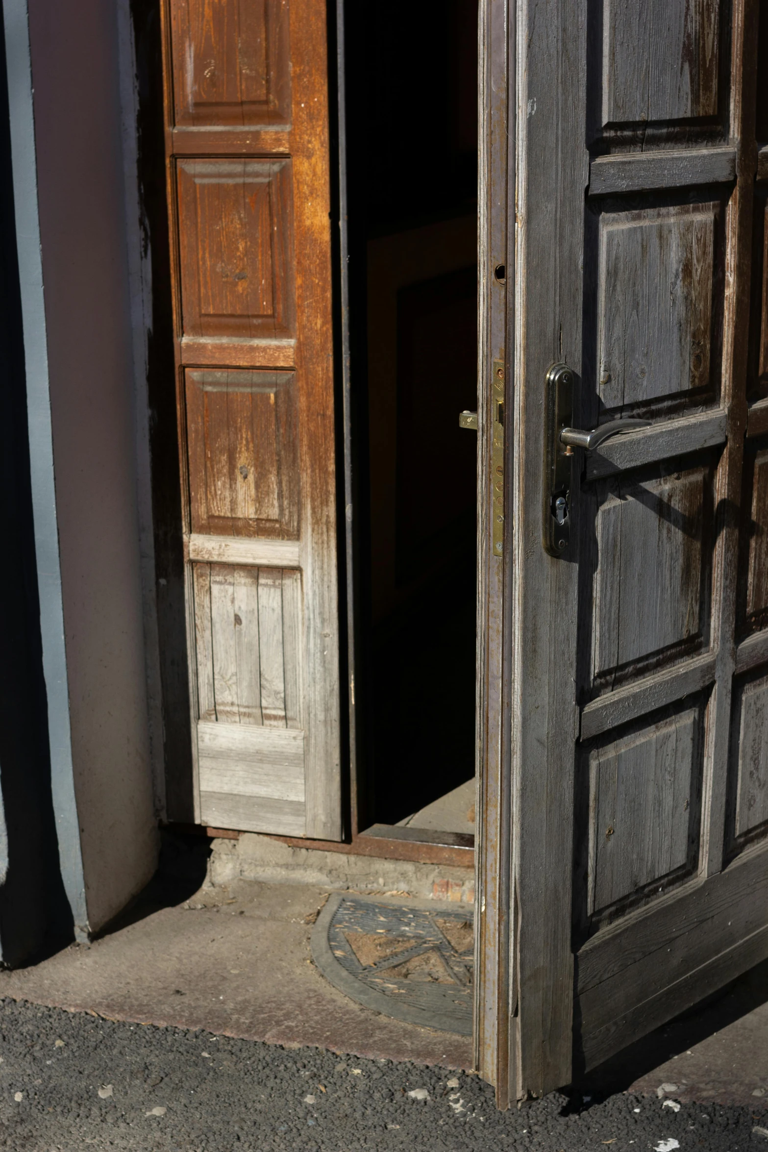an open door on the side of a building, restoration, reykjavik, photo of poor condition, light and dark