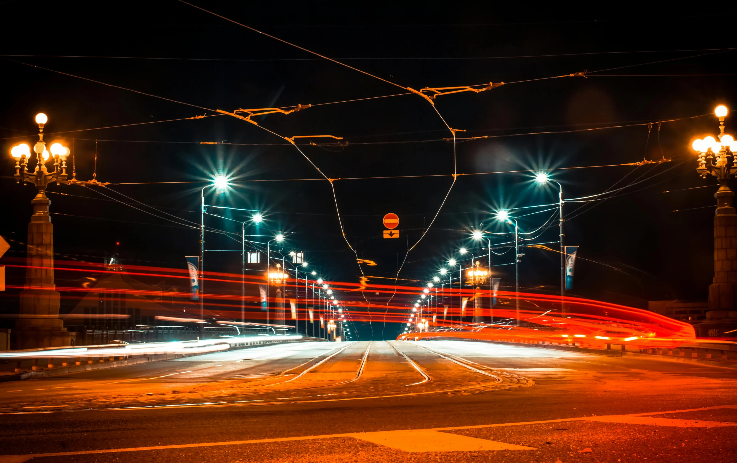 a city street filled with lots of traffic at night, a picture, by Thomas Häfner, pexels contest winner, electricity archs, orange teal lighting, speed lines, magical soviet town