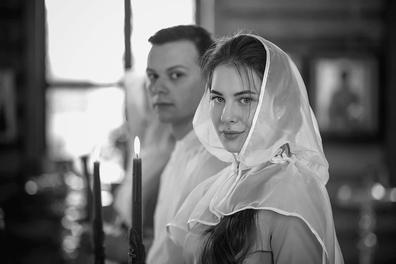 a black and white photo of a bride and groom, a black and white photo, by Svetlin Velinov, flickr, renaissance, baptism, 15081959 21121991 01012000 4k, looking serious, a pilgrim