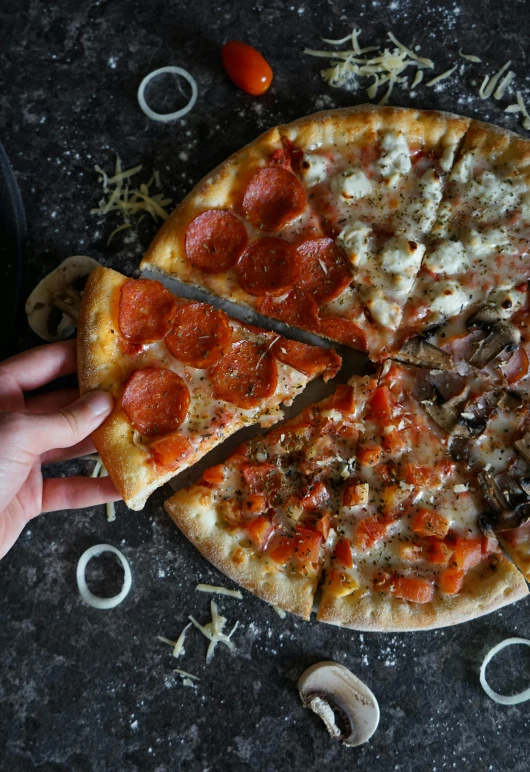 a pizza sitting on top of a table covered in toppings, by Robbie Trevino, unsplash, photorealism, sleek hands, split in half, 4 colors, tall