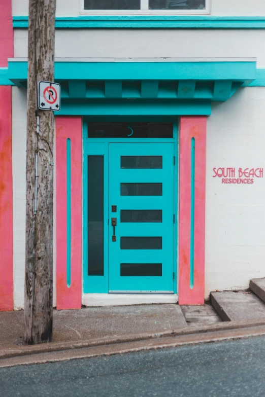 a pink and blue building with a blue door, red turquoise accents, sol retreat, graphic detail, soda