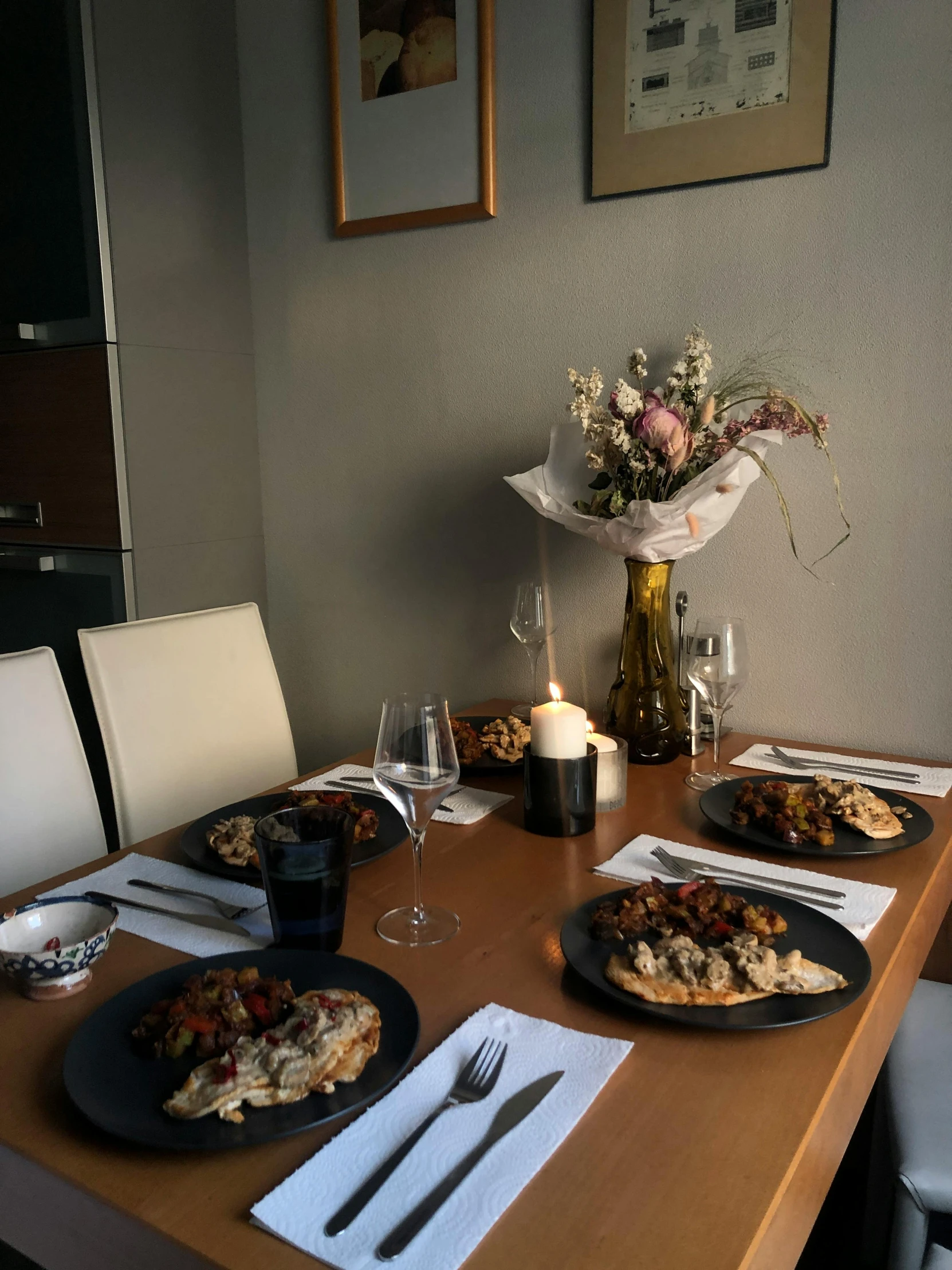 a wooden table topped with plates of food, profile image, cosy, michaelangelo style, grey