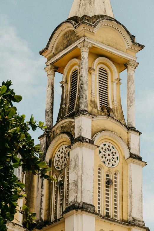 a tall tower with a clock on top of it, by Sam Dillemans, trending on unsplash, baroque, vietnam, yellowed with age, destroyed church, puerto rico