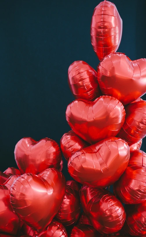 a bunch of red heart shaped balloons, pexels, tall, foil effect, romantic lead, laura watson