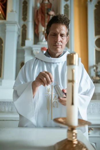 a priest lighting a candle in a church, a portrait, by Jan Tengnagel, unsplash, wearing nanotech honeycomb robe, production photo, white, 15081959 21121991 01012000 4k