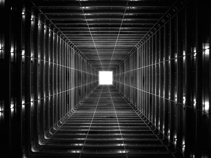 a black and white photo of a light at the end of a tunnel, a black and white photo, inspired by Ryoji Ikeda, light and space, symmetry!! solid cube of light, ceiling, symmetry! futuristic robotic, square lines