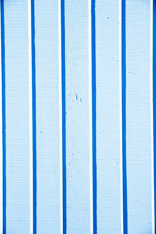 a red fire hydrant sitting in front of a blue wall, by Agnes Martin, low detail, ((blue)), striped, white wood