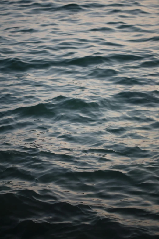 a close up of a body of water with waves, a photorealistic painting, inspired by Vija Celmins, unsplash, calm evening, paul barson, 'untitled 9 ', made of water