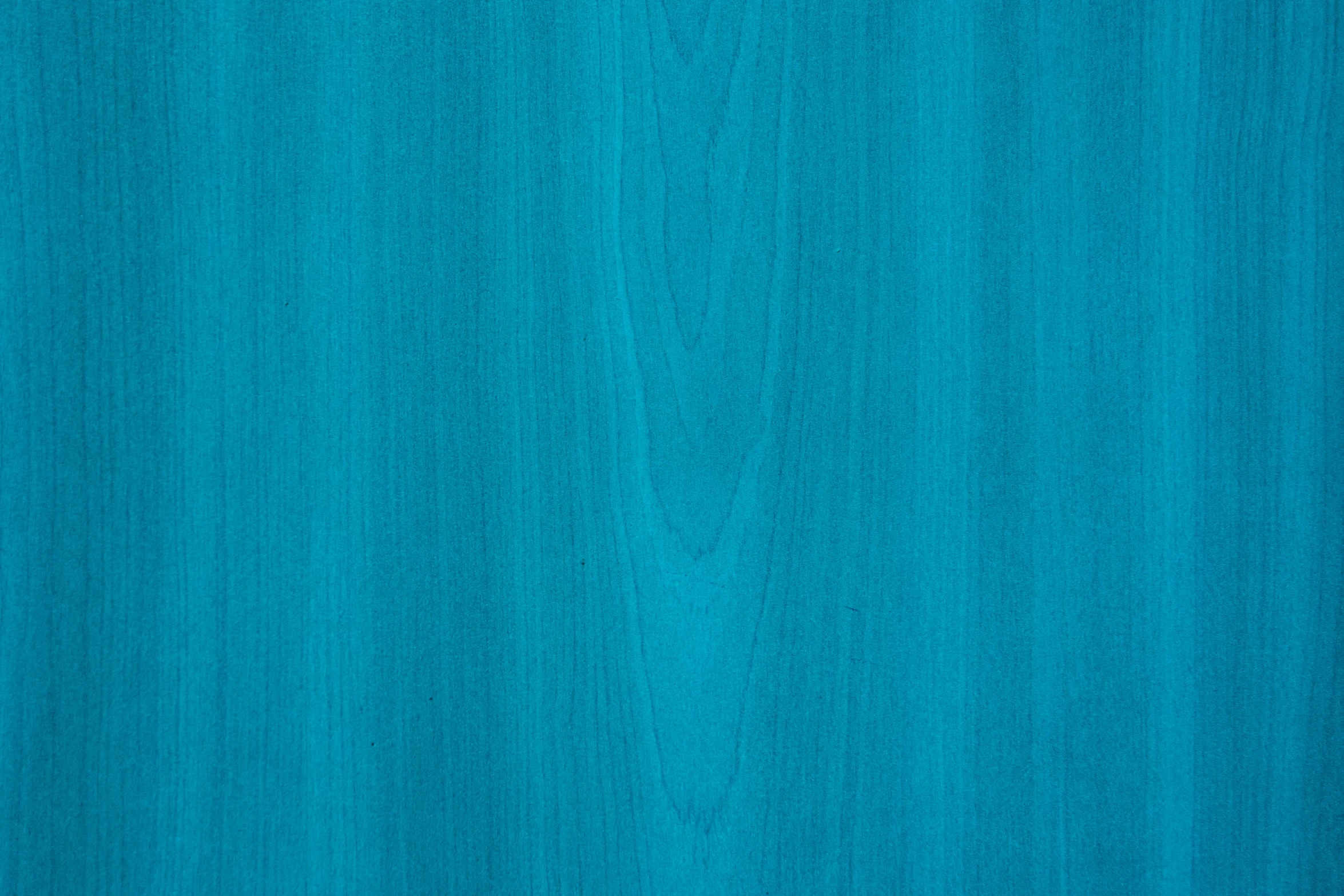 a close up of a blue wooden surface