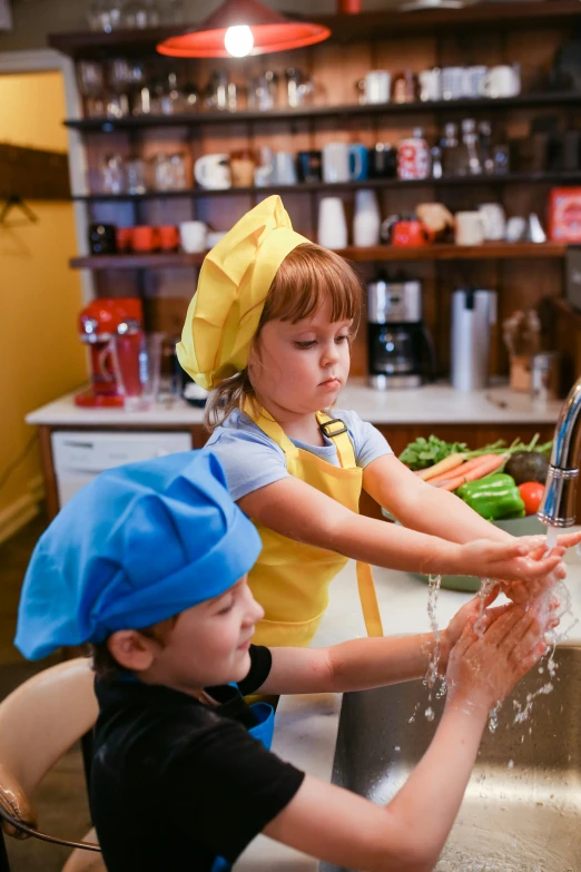 two children washing their hands in a kitchen sink, by Leo Michelson, pexels, wearing white chef hat, programming, square, fall