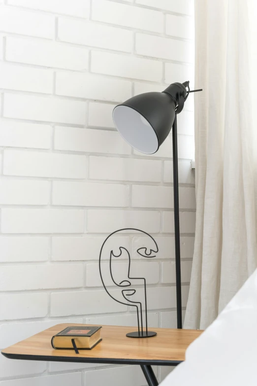 a lamp sitting on top of a wooden table next to a bed, a cartoon, inspired by Peter de Sève, face with artgram, made of wire, detail shot, ilustration
