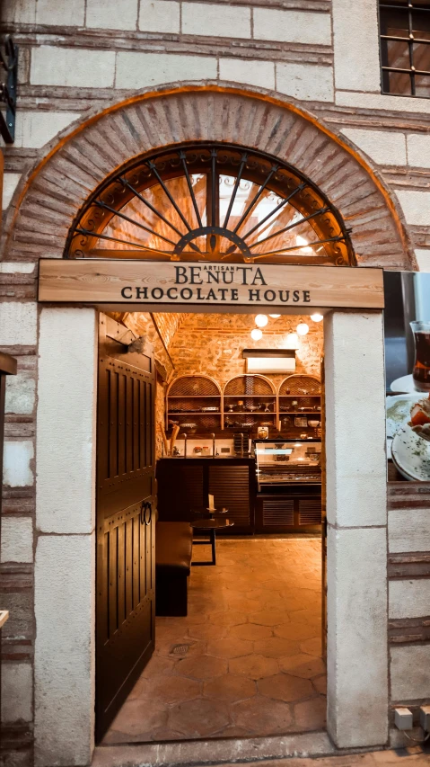 a building with a sign that says benuta chocolate house, a portrait, by Hirosada II, shutterstock, cavernous interior wide shot, thumbnail, opening, dessert