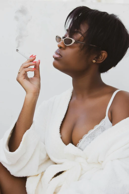 a woman in a bathrobe smoking a cigarette, trending on unsplash, in a black betch bra, black girl, wearing white camisole, smooggy