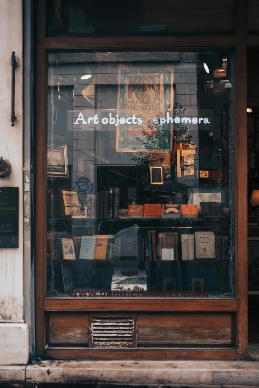 a store front with a sign in the window, art & language, papers and tomes, expensive masterpiece, beginner art, bookshelf