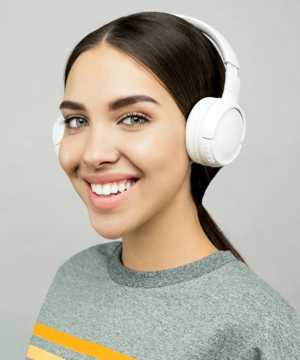 a woman wearing headphones and smiling at the camera, trending on pexels, hurufiyya, on a gray background, detailed product image, multiple stories, portrait of a teen robot