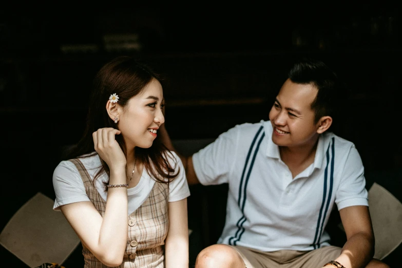 a man and a woman sitting next to each other, pexels contest winner, happening, asian female, 15081959 21121991 01012000 4k, flirting smiling, profile image