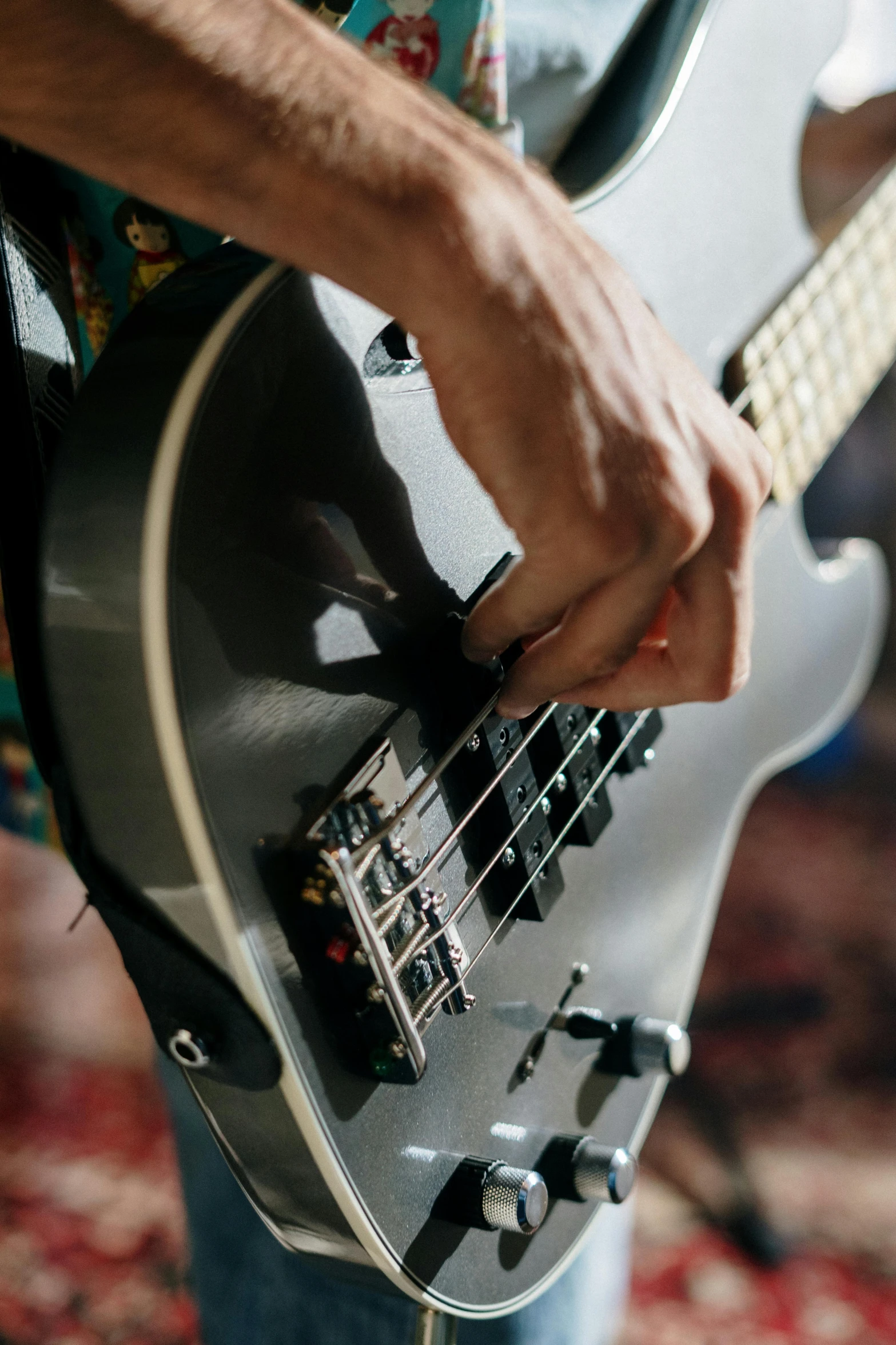 a close up of a person playing a guitar, profile image