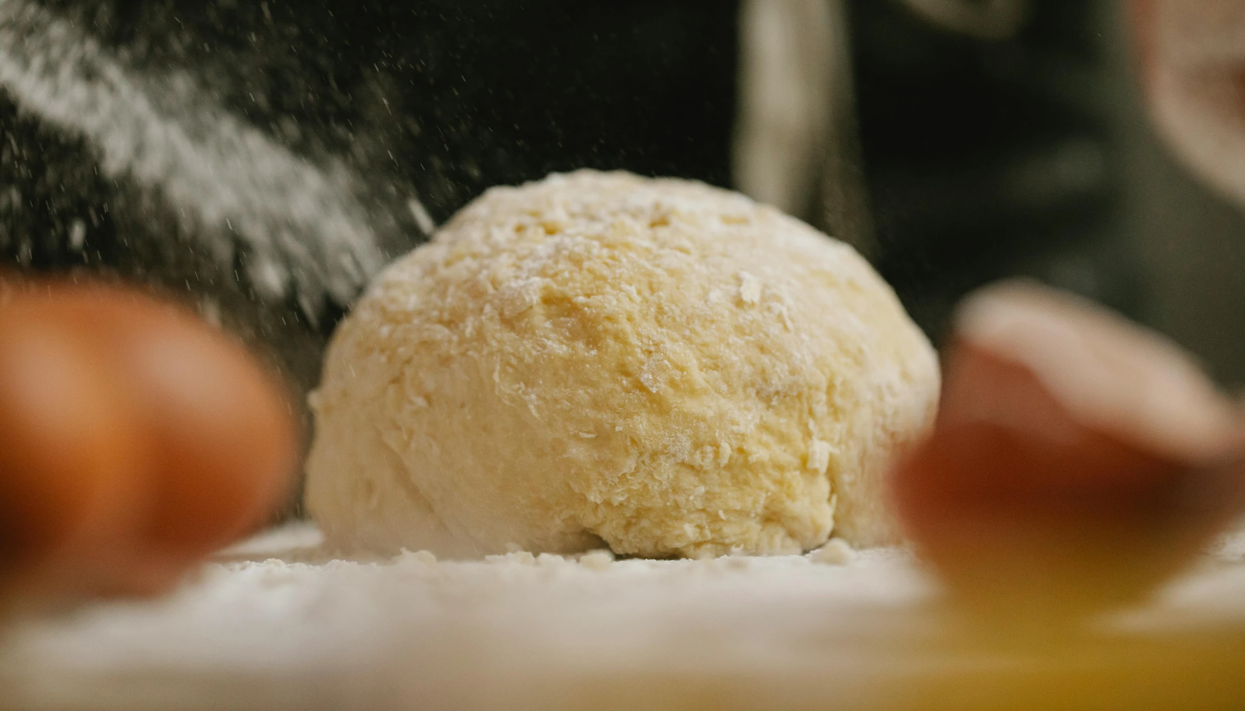 a ball of dough is sprinkled with powder, by Tom Bonson, unsplash, mash potatoes, neck zoomed in, film footage, uncropped