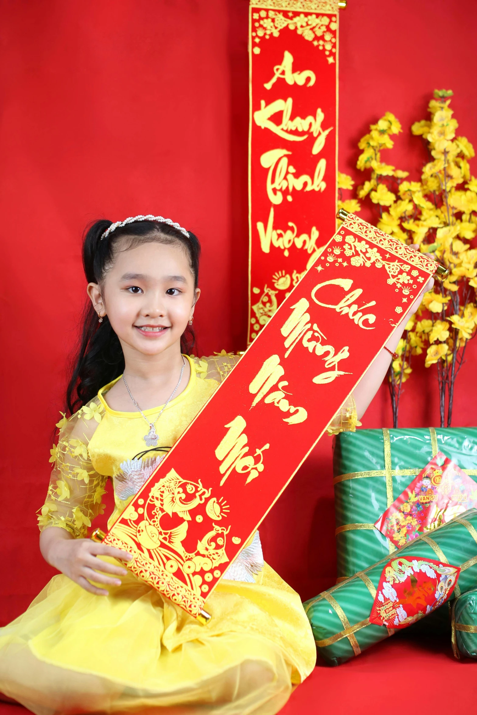 a little girl in a yellow dress holding a red sign, inspired by Cui Bai, ao dai, decorations, crispy quality, -n 9