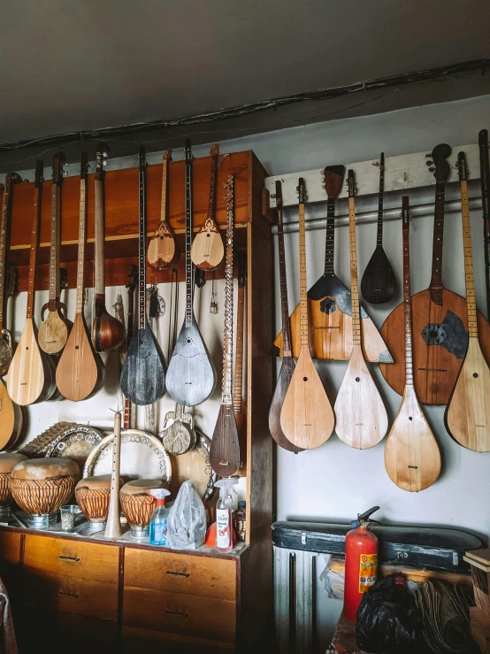 a room filled with lots of musical instruments, unsplash, arts and crafts movement, polish mansion kitchen, 💣 💥💣 💥, hasbulla magomedov, lute