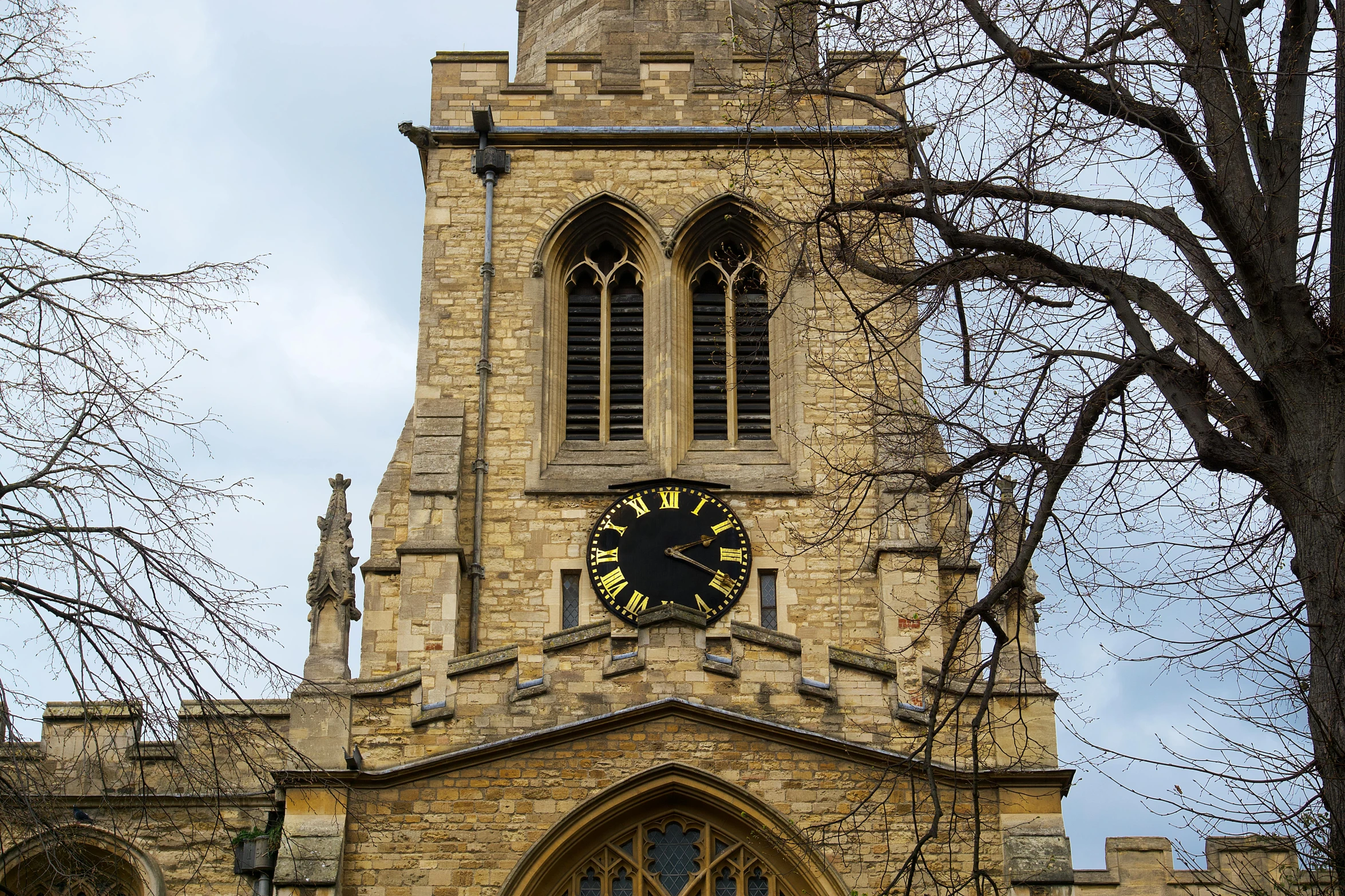 a clock that is on the side of a building, a photo, by Kev Walker, unsplash, arts and crafts movement, lead - covered spire, the narthex, barnet, profile picture 1024px