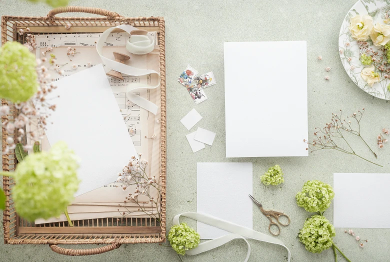 a basket sitting on top of a table filled with flowers, inspired by Eden Box, pexels, private press, whiteboards, parchment paper, white, various items