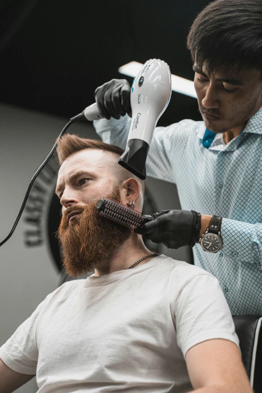 a man getting his hair cut by a barber, trending on unsplash, reddish beard, very long neck, australian, fantasy themed
