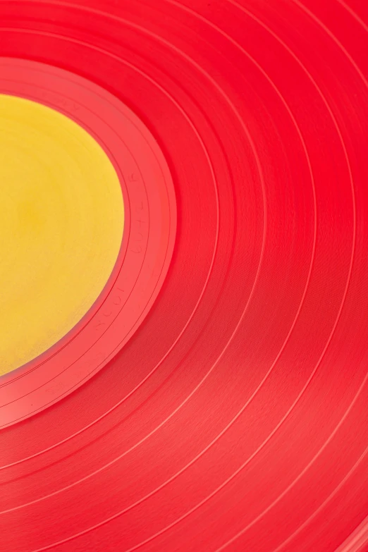 a red record with a yellow disc in the middle, by Doug Ohlson, pexels contest winner, synthetism, colored layers, large format, promo image, colorful plastic