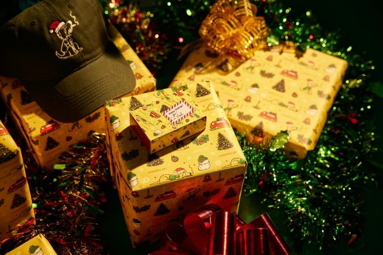 a pile of presents sitting on top of a table, graffiti, hat and hoodie, zoomed in shots, green and gold, props containing trees