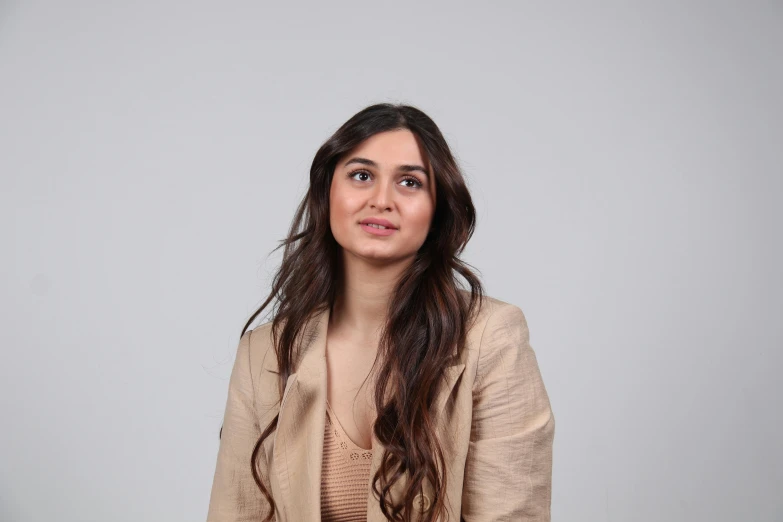 a beautiful young woman posing for a picture, trending on pexels, hurufiyya, with brown hair, clear background, official photo, side pose