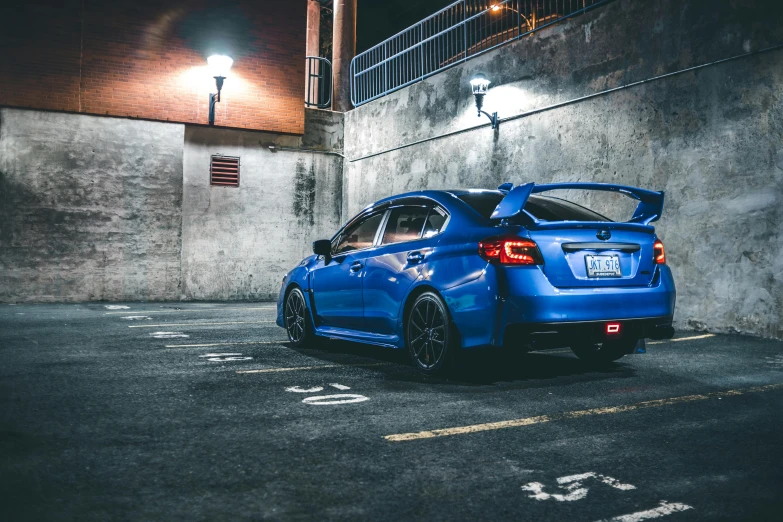 a blue car parked in a parking lot at night, inspired by An Gyeon, pexels contest winner, wrx golf, back pose, instagram post, back arched