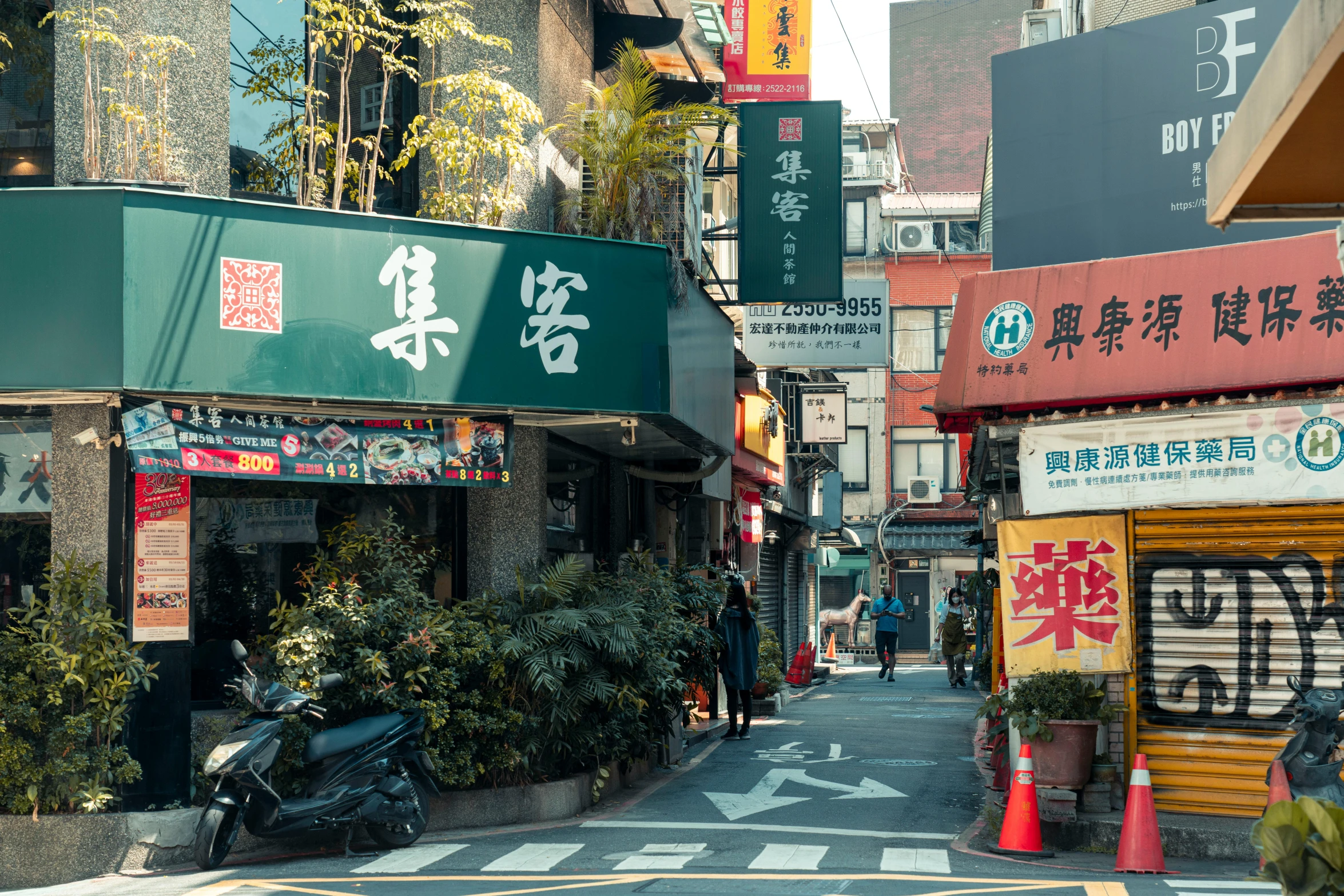 a motorcycle parked on the side of a street, trending on unsplash, mingei, lots of signs and shops, chinese building, green alley, 2000s photo