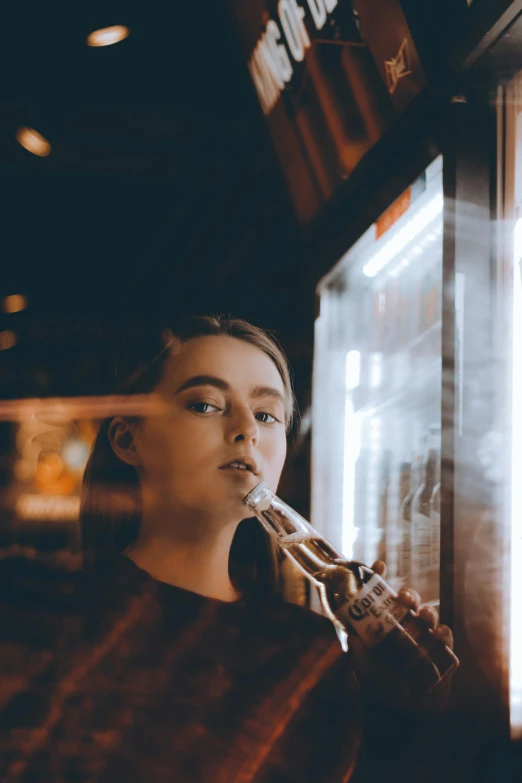 a man smoking a cigarette in front of a window, inspired by Elsa Bleda, pexels contest winner, young girl playing flute, drinking at the bar, sydney sweeney, lights inside