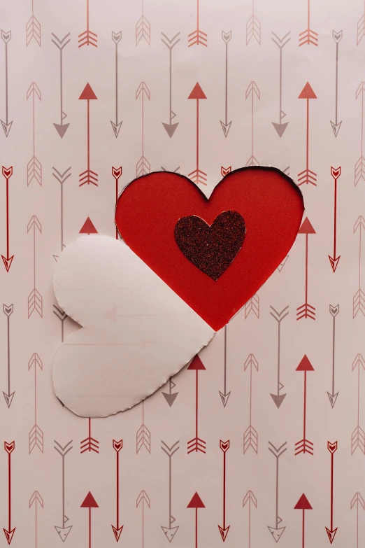 a piece of paper with a heart cut out of it, an album cover, by Valentine Hugo, pexels, arrows, pattern, holiday, panel