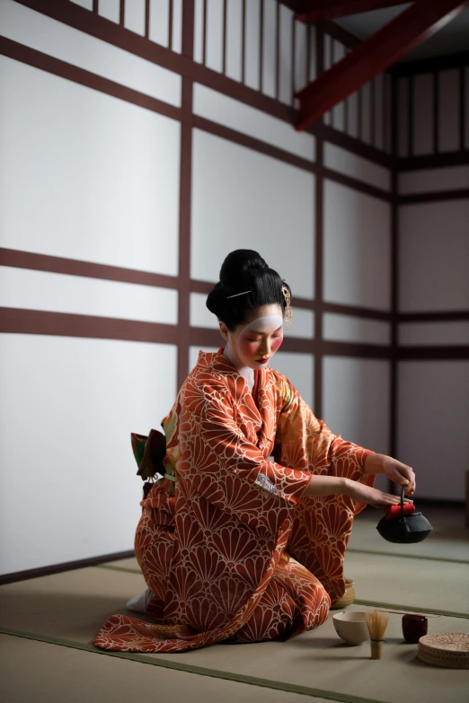 a woman in a kimono sitting on the floor, pexels contest winner, holding a bell, as though she is dancing, square, ( ( theatrical ) )